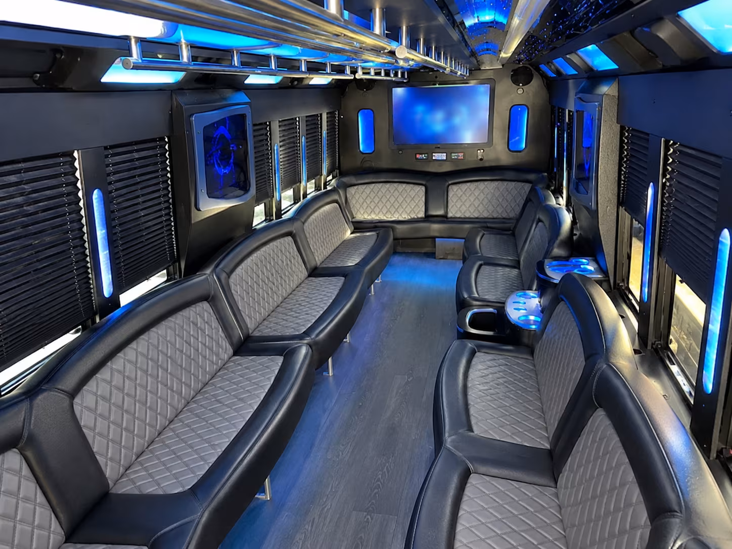 Wedding guests seated inside a party bus serving Fargo